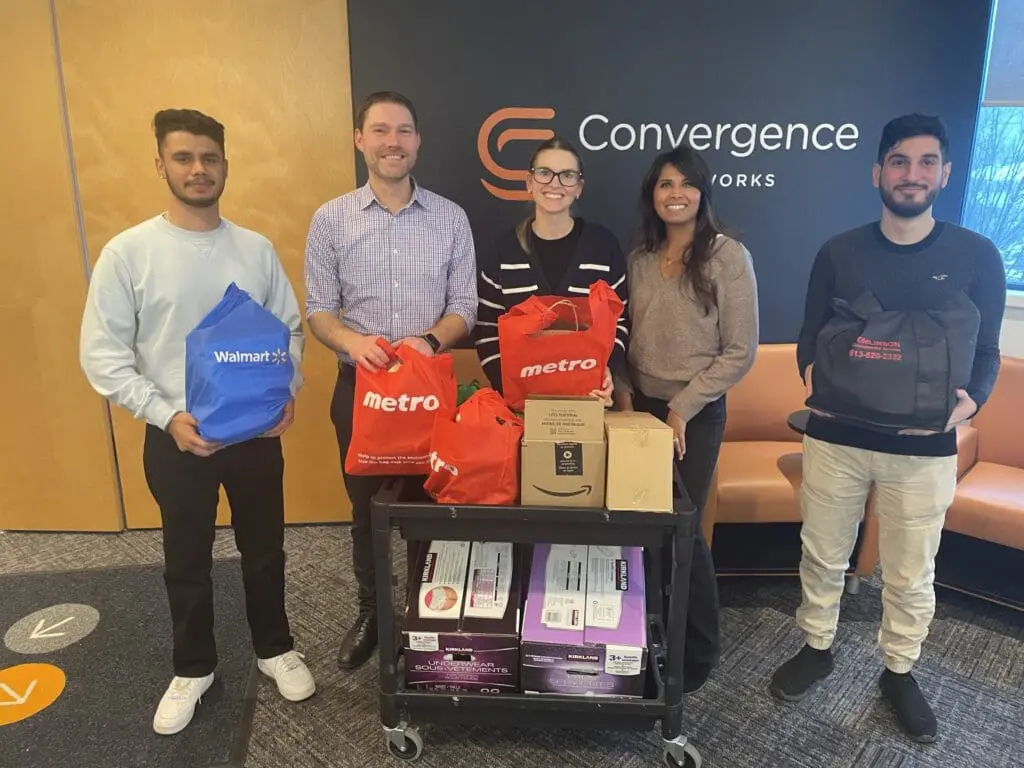 Convergence Networks team volunteering and fundraising for local charities, supporting communities during the holiday season.