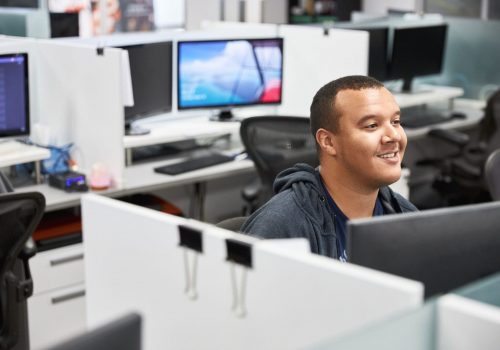 IT professional collaborating with external IT partner on business solutions