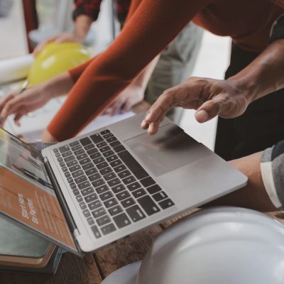 Group architects and engineers build houses and conference build Group architects and engineers build houses and conference buildings together to design and build structures, sketch house plans to meet construction standards. Ideas for designing and building house.