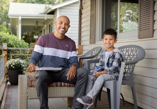 VolunteerChild_Porch_ToCamera